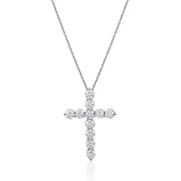 The Karat Concierge 14K white gold cross necklace featuring 11 sparkling round diamonds on a delicate chain.