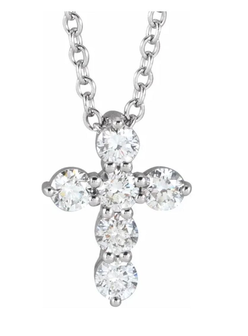 The Karat Concierge diamond cross pendant necklace featuring five brilliant-cut diamonds set in polished silver