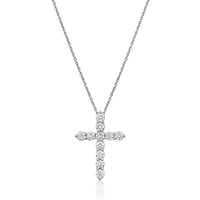 The Karat Concierge 14K white gold cross necklace featuring 11 sparkling round-cut diamonds on a delicate chain.