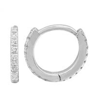 The Karat Concierge 14K white gold eternity huggie earrings featuring sparkling diamonds on front and back.