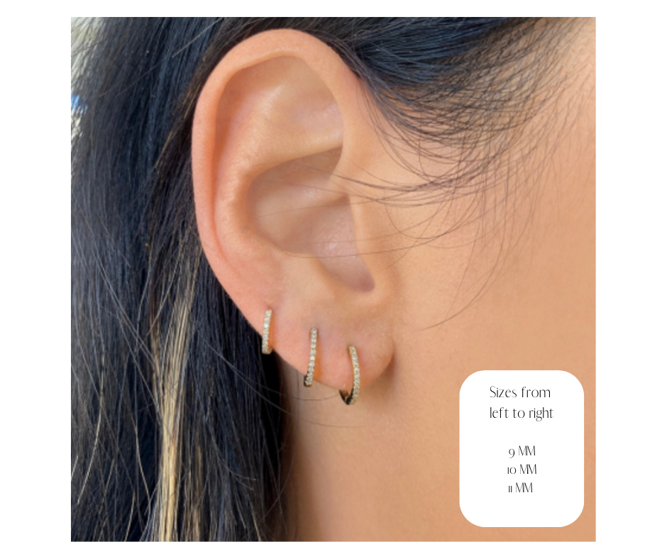 The Karat Concierge diamond huggie earrings in 9mm, 10mm, and 11mm sizes worn on a model's earlobe.