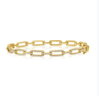 The Karat Concierge diamond link bangle in 14K yellow gold with .54 CTW pavé diamonds and a double latch closure.