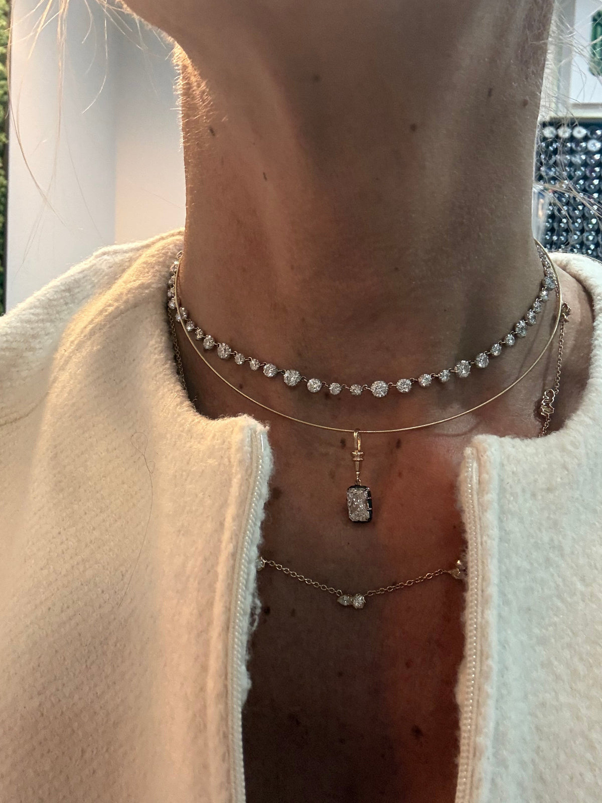 The Karat Concierge Georgian-style pendant with a radiant cut lab-grown diamond, black rhodium, and yellow gold chain.