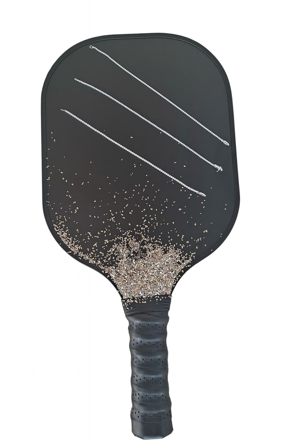 The Karat Concierge diamond tennis bracelets displayed on a black pickleball paddle with decorative stone accents.