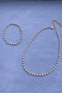 The Karat Concierge 14K yellow gold lab-grown diamond tennis necklace and matching bracelet with 8-prong settings.