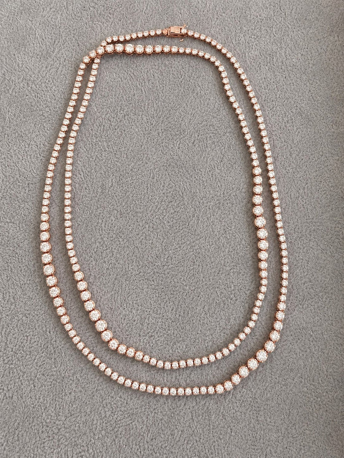 The Karat Concierge 32-inch tennis necklace in 14K white and rose gold with 13 carats of sparkling natural diamonds.
