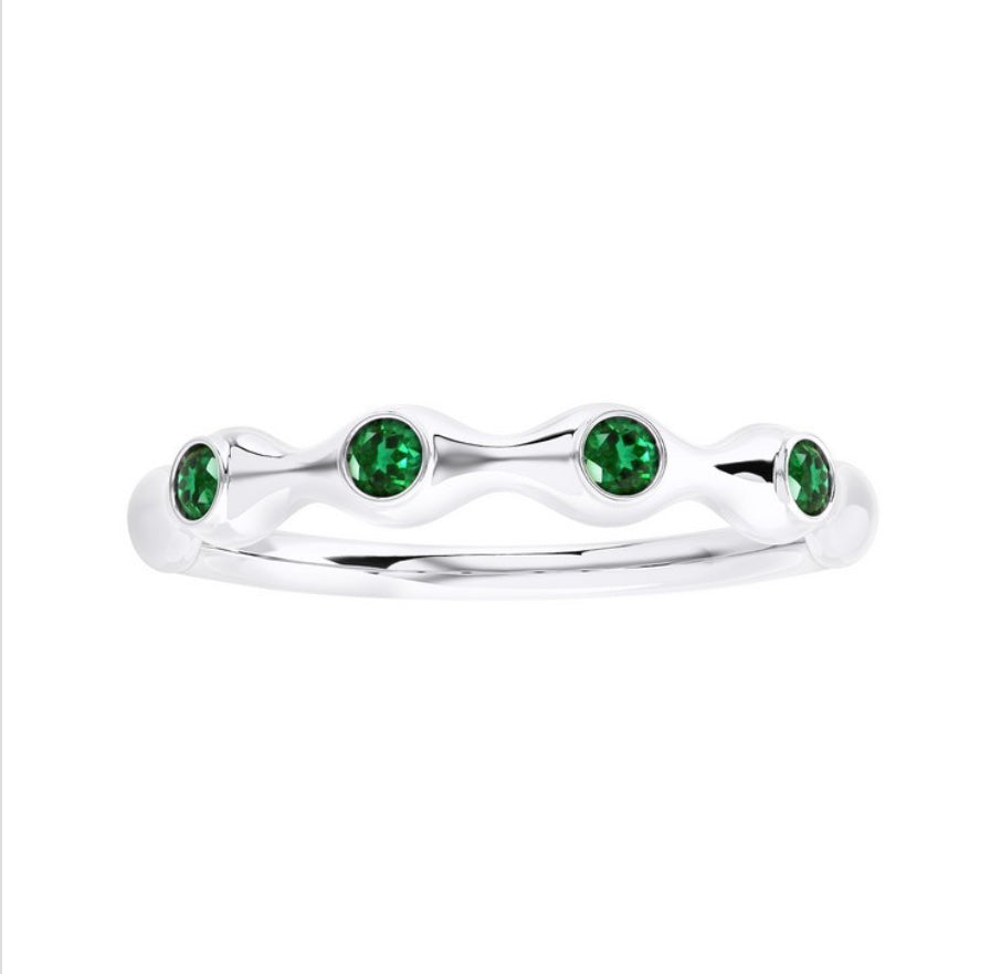 The Karat Concierge bamboo-style ring in 18K gold featuring four round green emerald gemstones in a stackable design.