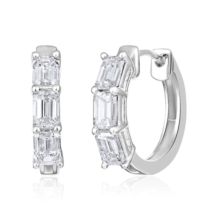 The Karat Concierge 14K white gold huggie earrings featuring three emerald cut natural diamonds per hoop
