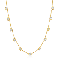 The Karat Concierge Sloane Bezel Bet emerald cut diamond necklace in 14K yellow gold with bezel set stones.