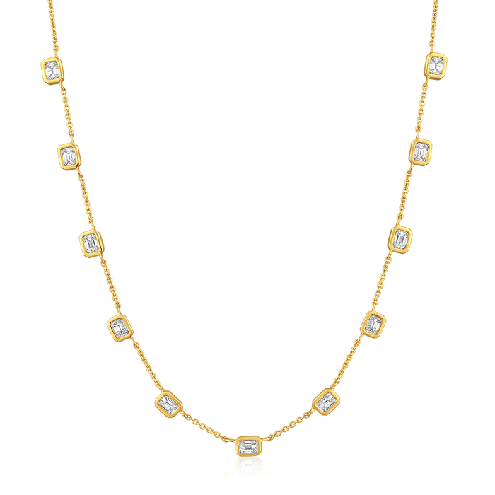 The Karat Concierge Sloane Bezel Bet emerald cut diamond necklace in 14K yellow gold with bezel set stones.