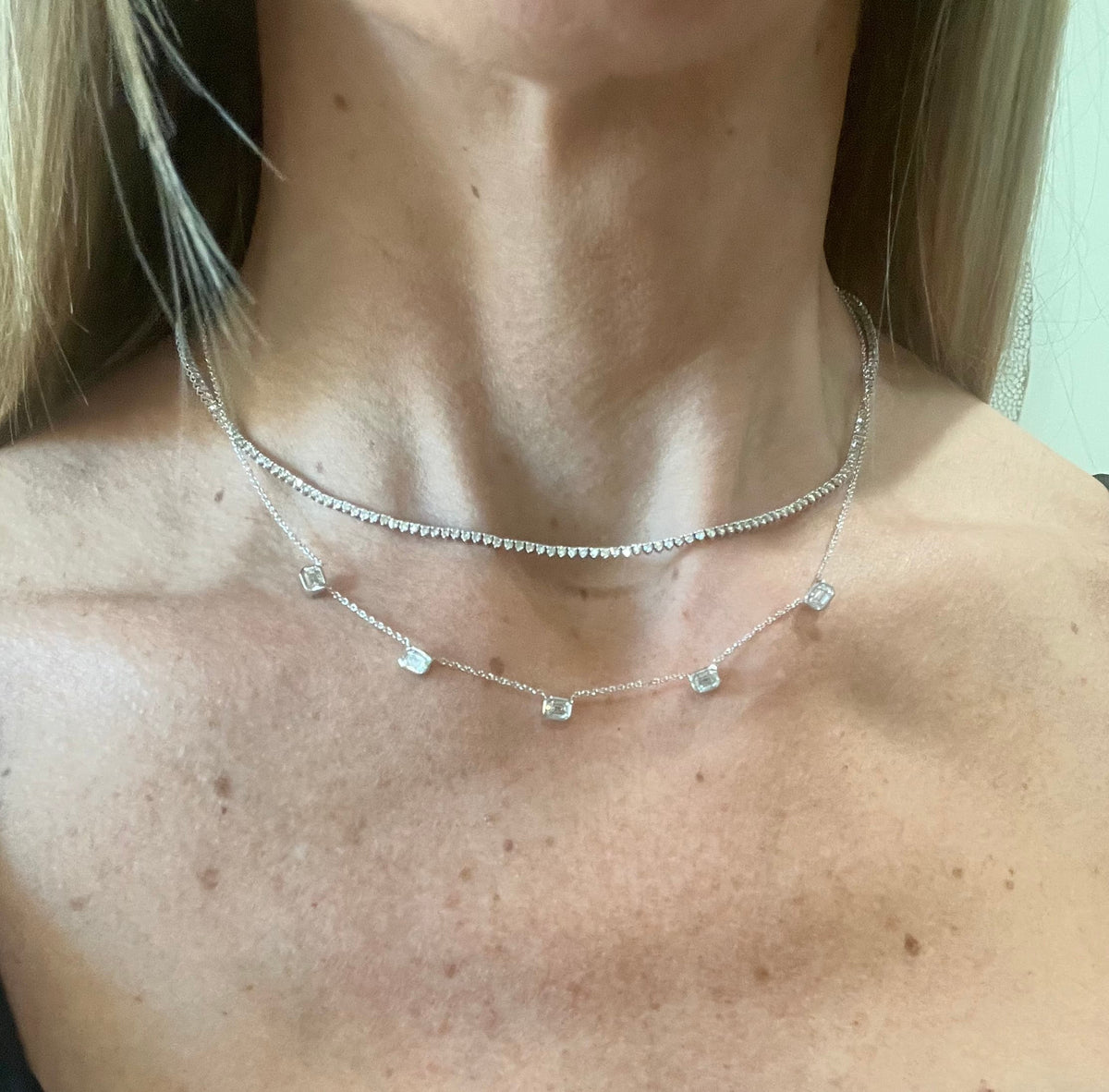 The Karat Concierge 14K white gold necklace featuring five bezel-set emerald cut lab grown diamonds on a delicate chain.
