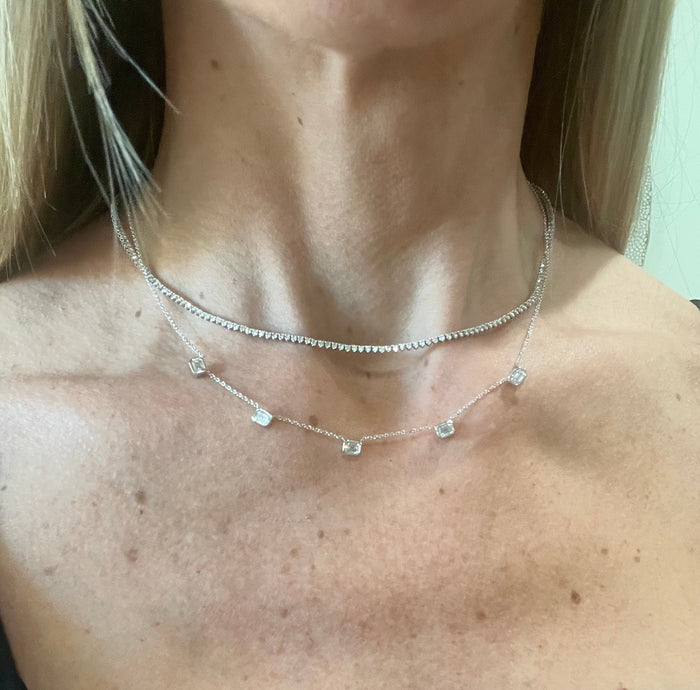 The Karat Concierge 14K white gold necklace featuring five bezel-set emerald cut lab grown diamonds on a delicate chain.