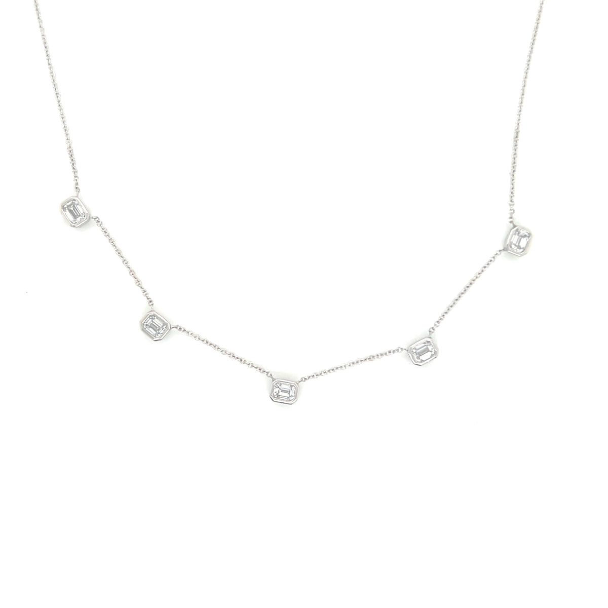 The Karat Concierge 14K white gold necklace featuring five bezel set emerald cut lab grown diamonds on a delicate chain