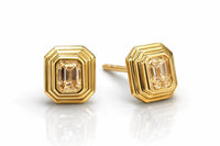 The Karat Concierge Gatsby Stud earrings featuring emerald cut diamonds in 14K yellow gold faceted bezel settings.