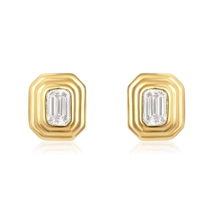 The Karat Concierge Gatsby emerald cut diamond stud earrings in 14K yellow gold with a faceted bezel setting.