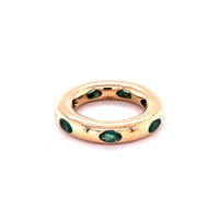 The Karat Concierge 14KT yellow gold donut ring featuring oval cut emeralds in a sleek, whimsical stackable design.
