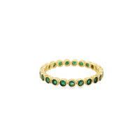 The Karat Concierge 14K yellow gold eternity band featuring a continuous row of bezel-set vibrant green emeralds.