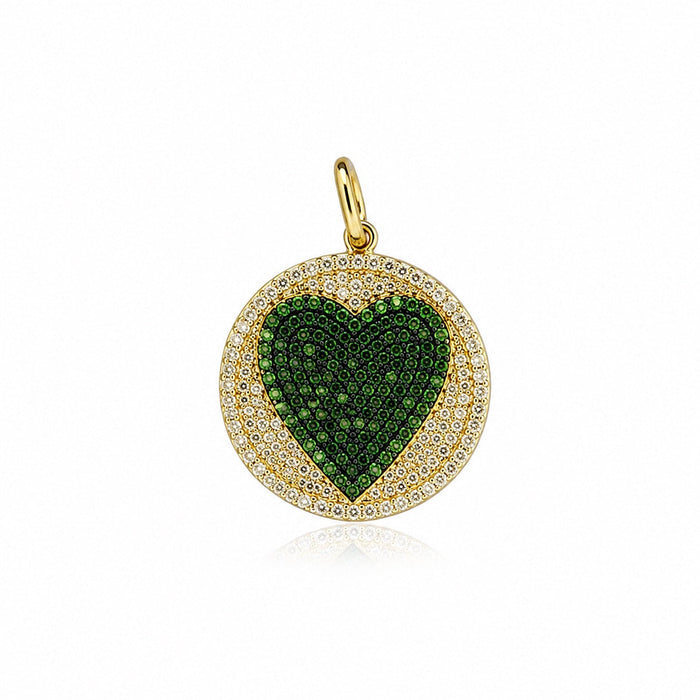 The Karat Concierge round pendant featuring a pavé emerald heart surrounded by diamonds in 14K yellow gold.