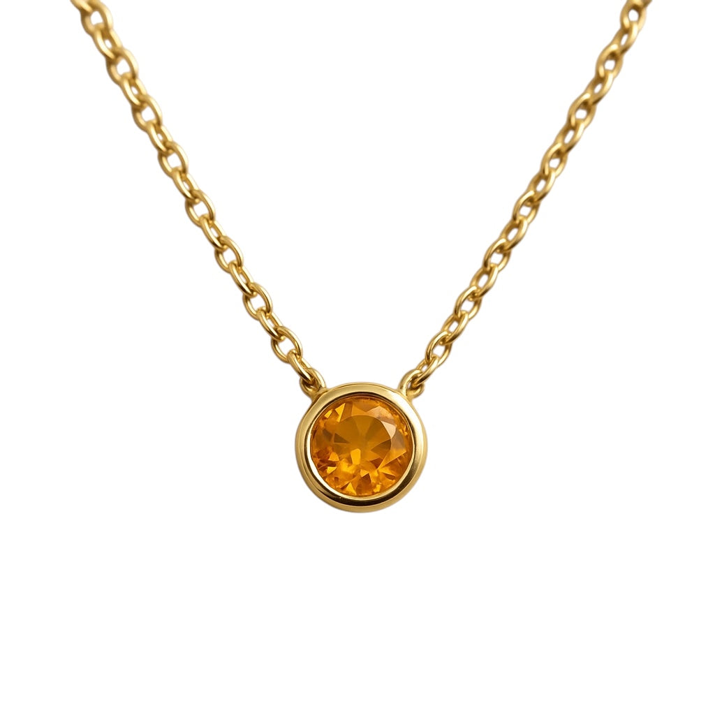 The Karat Concierge 14K yellow gold necklace with a round bezel-set burnt orange citrine stone on a delicate chain.