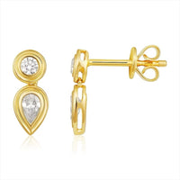 The Karat Concierge Gatsby drop earrings in 14K gold with bezel-set round and pear-shaped natural diamonds.