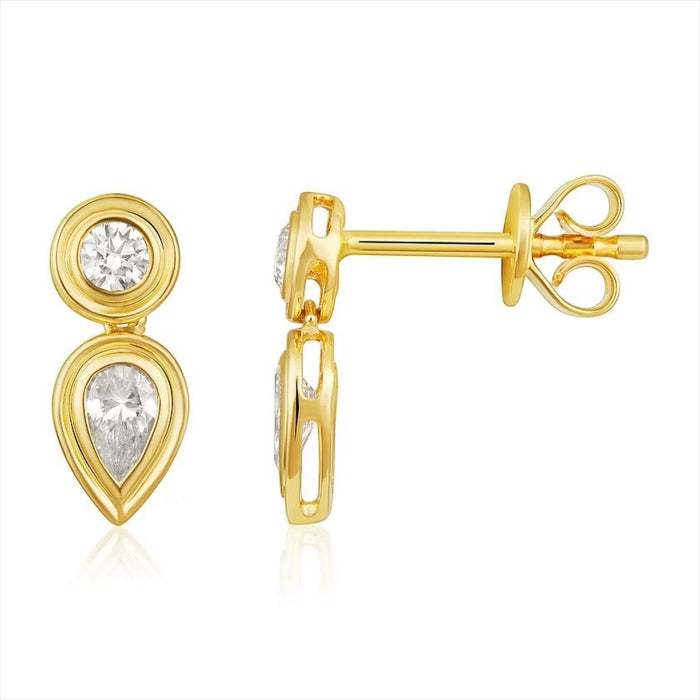 The Karat Concierge Gatsby drop earrings in 14K gold with bezel-set round and pear-shaped natural diamonds.