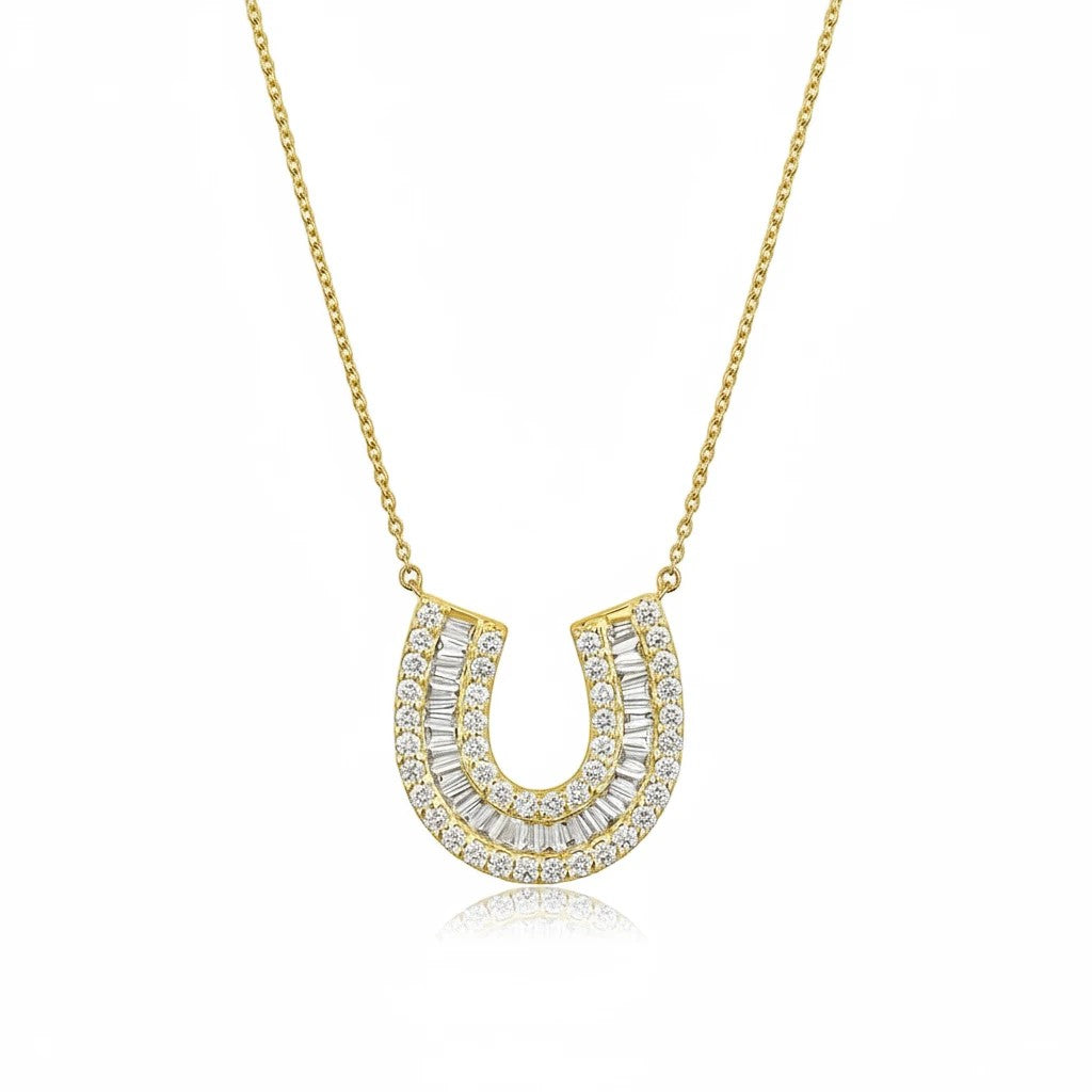 The Karat Concierge 14K yellow gold horseshoe necklace featuring baguette and round pavé diamonds on a delicate chain.