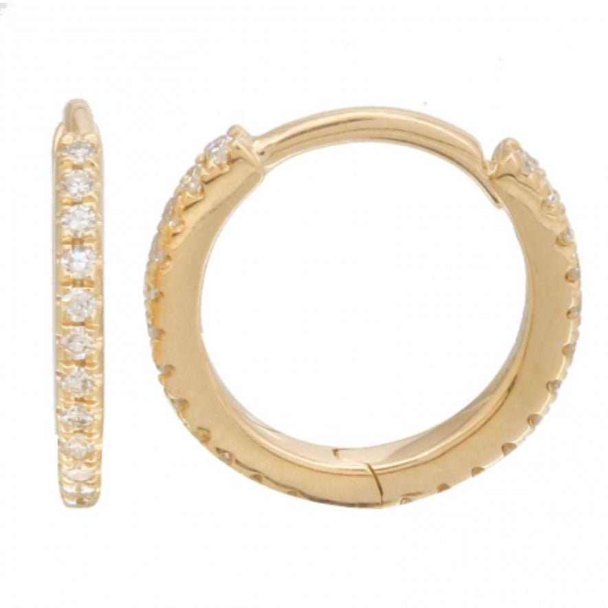 The Karat Concierge 14K yellow gold eternity huggie earrings featuring a row of sparkling diamonds.