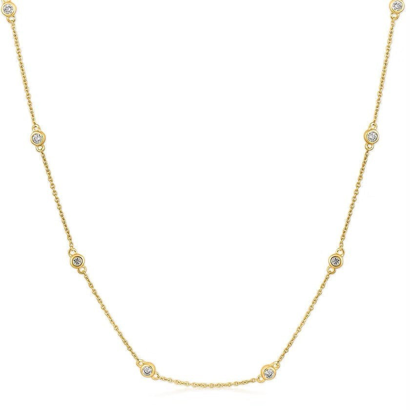 The Karat Concierge diamonds by the yard necklace in 14K yellow gold with bezel set round diamonds on a delicate chain