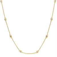 The Karat Concierge diamonds by the yard necklace in 14K yellow gold with bezel set round diamonds on a delicate chain