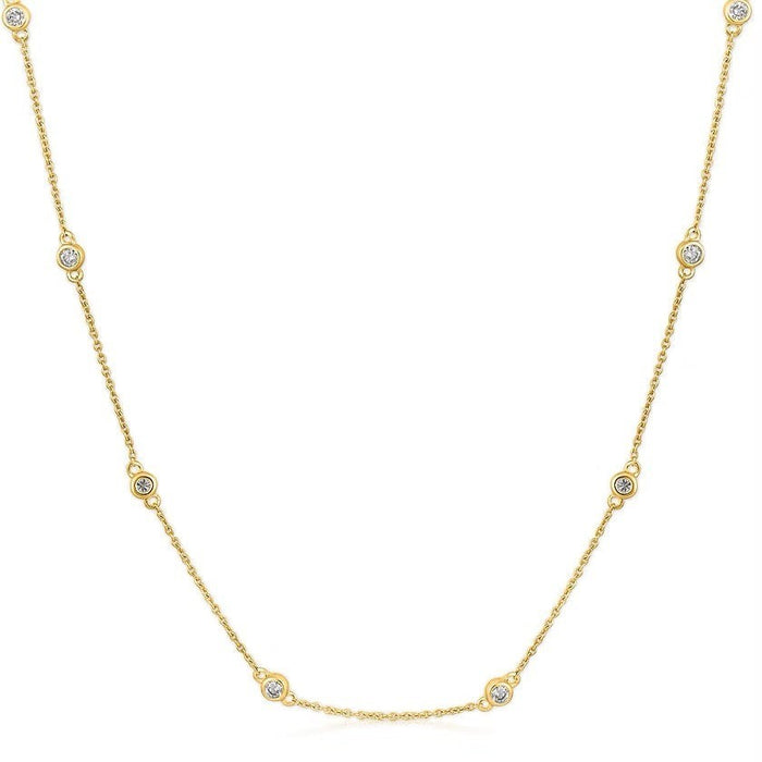 The Karat Concierge diamonds by the yard necklace in 14K yellow gold with bezel set round diamonds on a delicate chain