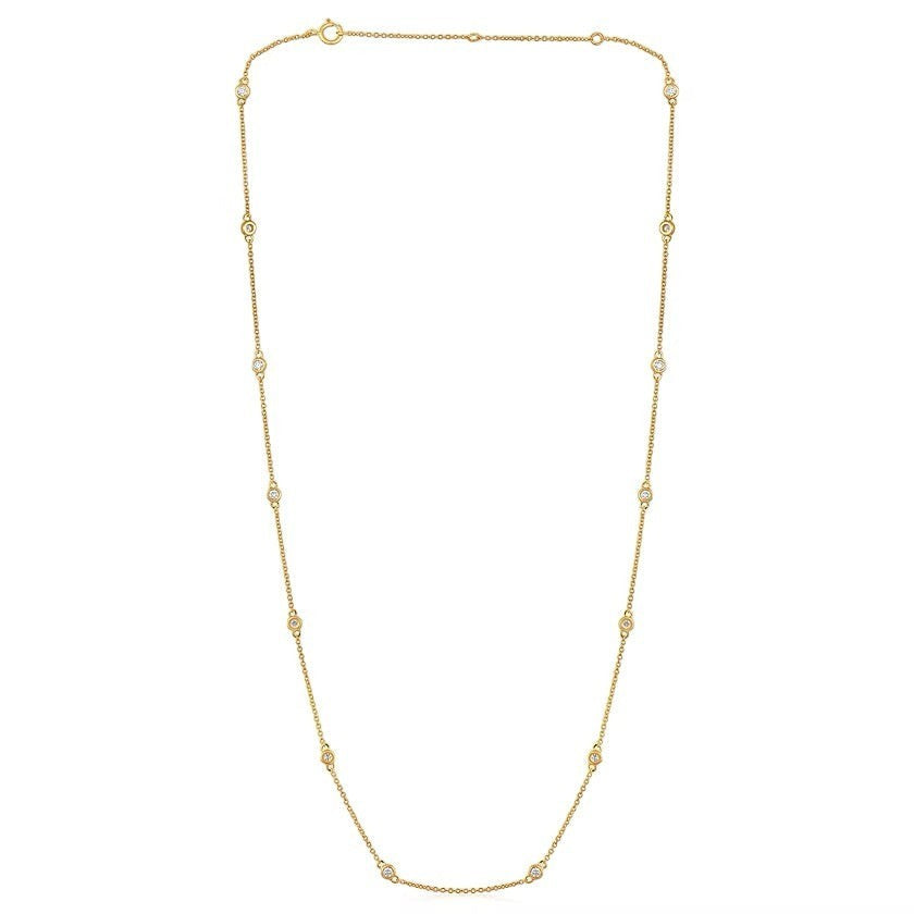 The Karat Concierge diamonds by the yard necklace in 14K yellow gold with bezel set round diamonds on a delicate chain
