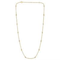 The Karat Concierge diamonds by the yard necklace in 14K yellow gold with bezel set round diamonds on a delicate chain