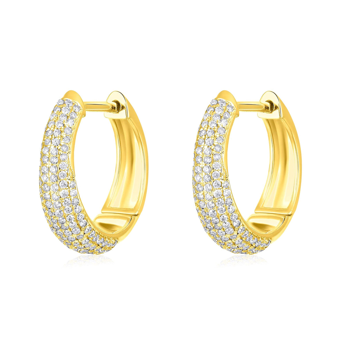 The Karat Concierge Myra huggie earrings in yellow gold featuring a pave diamond setting.