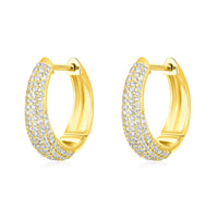 The Karat Concierge Myra huggie earrings in yellow gold featuring a pave diamond setting.