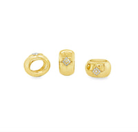 The Karat Concierge 14K yellow gold oval rondelle charms with star-shaped diamond settings for bangle bracelets