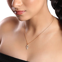 The Karat Concierge 14K gold Hamsa pendant necklace featuring 109 natural diamonds worn by a woman.