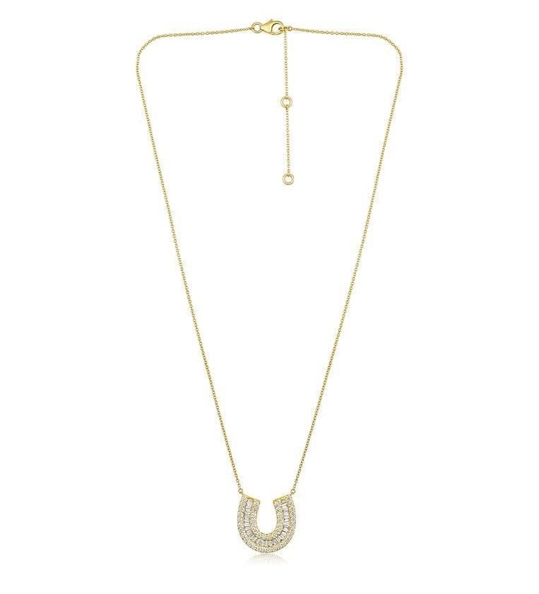 The Karat Concierge Fortuna Pave Horseshoe Necklace in 14K yellow gold with baguette and round pavé diamonds.