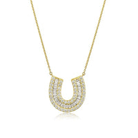 The Karat Concierge 14K yellow gold horseshoe necklace featuring baguette and round pavé diamonds on a delicate chain.
