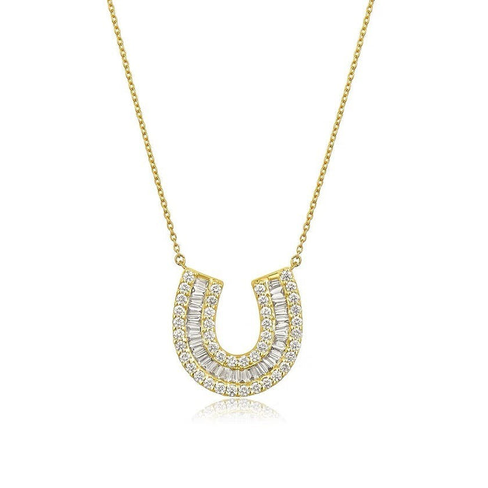 The Karat Concierge 14K yellow gold horseshoe necklace featuring baguette and round pavé diamonds on a delicate chain.