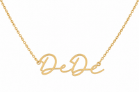 The Karat Concierge custom name necklace in 14K yellow gold with elegant script lettering on a delicate chain.