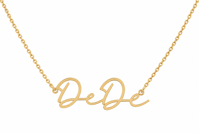 The Karat Concierge custom name necklace in 14K yellow gold with elegant script lettering on a delicate chain.