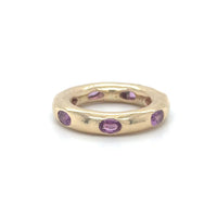 The Karat Concierge 14KT yellow gold donut ring featuring oval-cut pink sapphires in a sleek, whimsical setting.