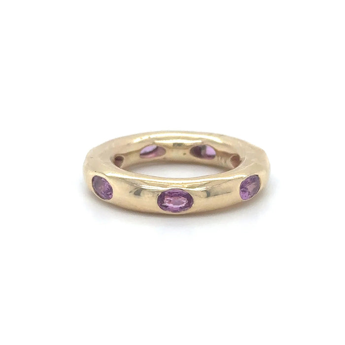 The Karat Concierge 14KT yellow gold donut ring featuring oval-cut pink sapphires in a sleek, whimsical setting.
