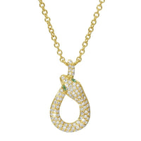 The Karat Concierge 14K yellow gold snake necklace with pavé diamonds and green tsavorite eyes on an 18-inch chain.