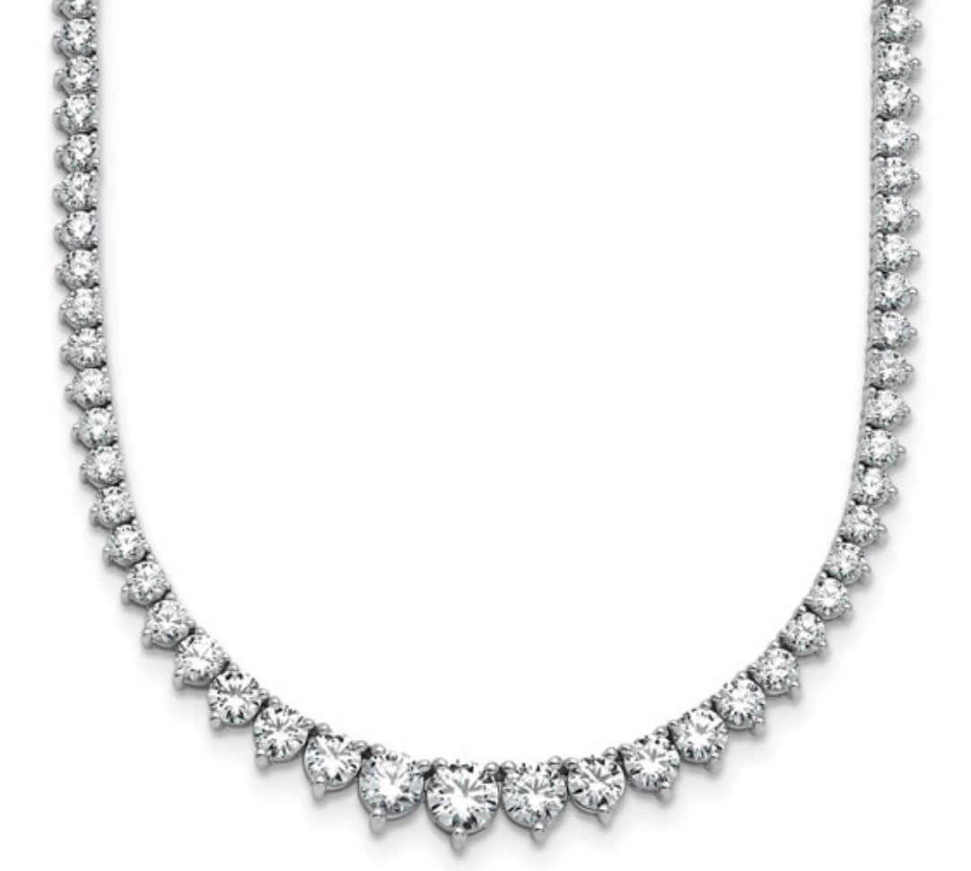 The Karat Concierge graduated tennis necklace in 14K white gold with sparkling stones in a classic 3-prong setting.