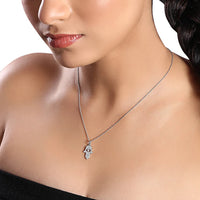 The Karat Concierge 14K gold Hamsa pendant necklace featuring 109 natural diamonds worn by a woman.