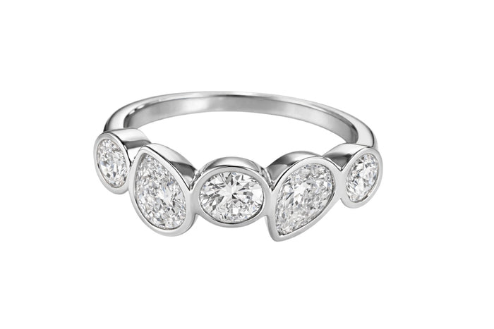 The Karat Concierge Muse ring featuring five bezel-set lab grown diamonds in 14K white gold with round and pear cuts.