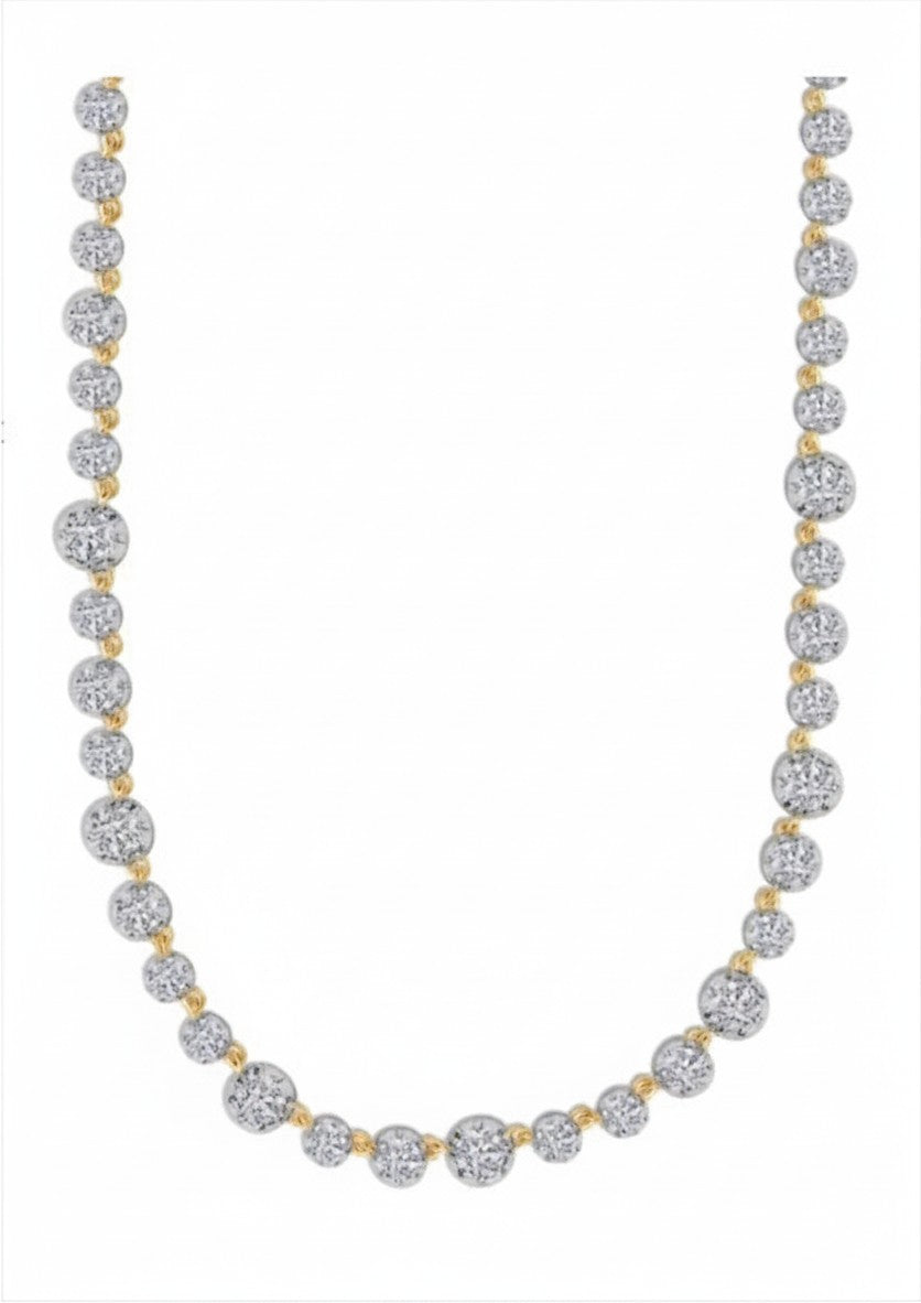 The Karat Concierge 14K yellow gold tennis necklace featuring 29 lab-grown diamonds in a Georgian 8-prong setting.
