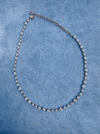 The Karat Concierge 14K yellow gold tennis necklace with 10.25ct lab-grown diamonds in a Georgian 8-prong setting.