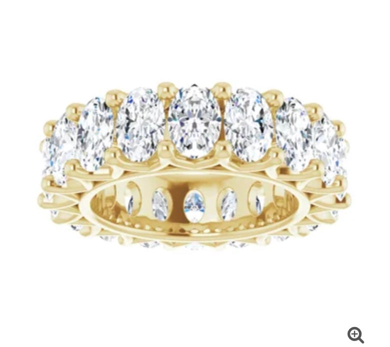 The Karat Concierge oval lab grown diamond eternity band in yellow gold with FG color VS clarity stones.